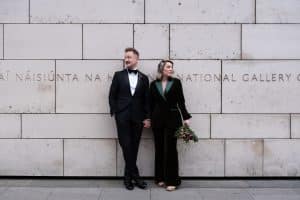 couple standing at the wall holding hands at the National Gallery of Ireland