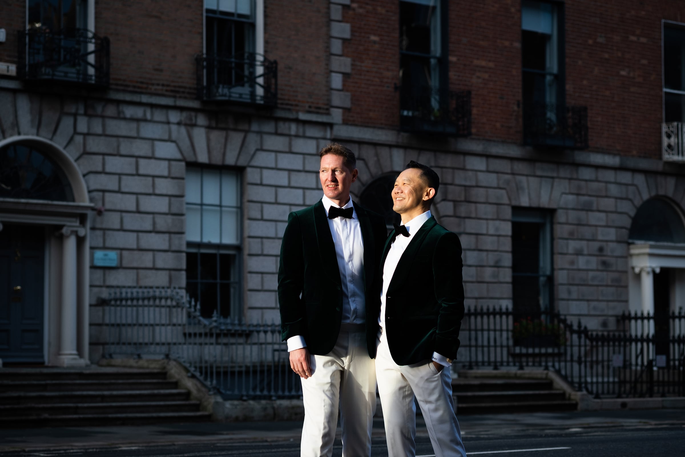 grooms standing in the Dublin sunlight, candid wedding photography