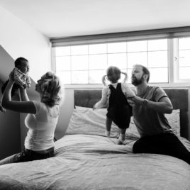 picture of family in the bedroom playing