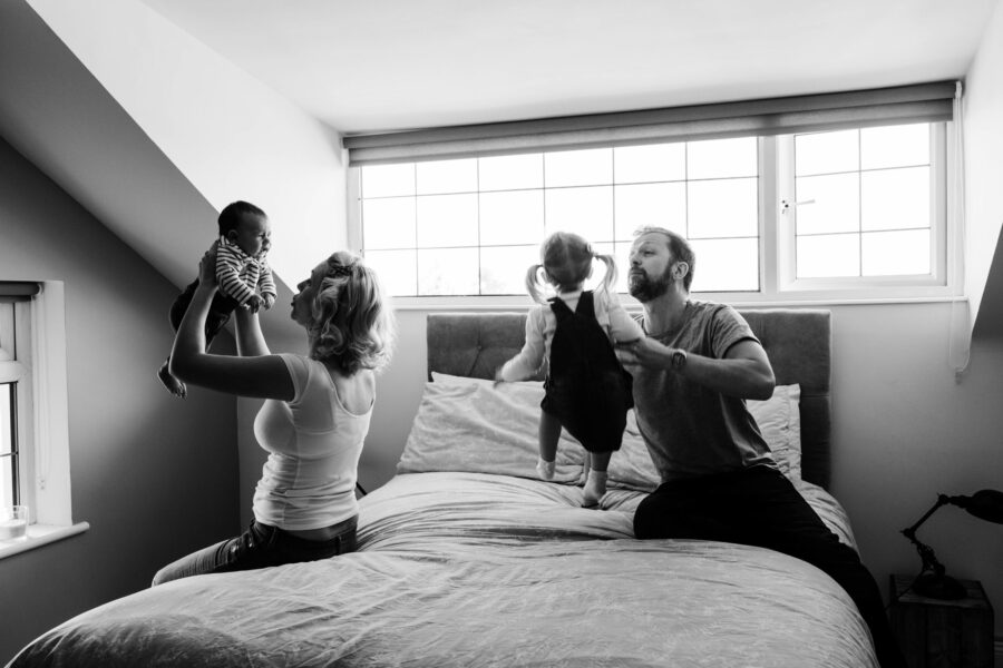 picture of family in the bedroom playing