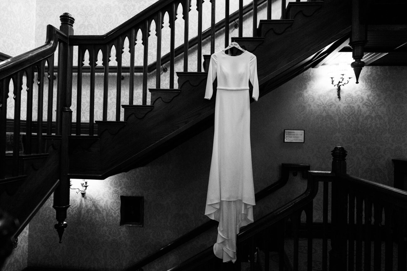 Wedding dress hanging on the stairs at Kilronan Castle
