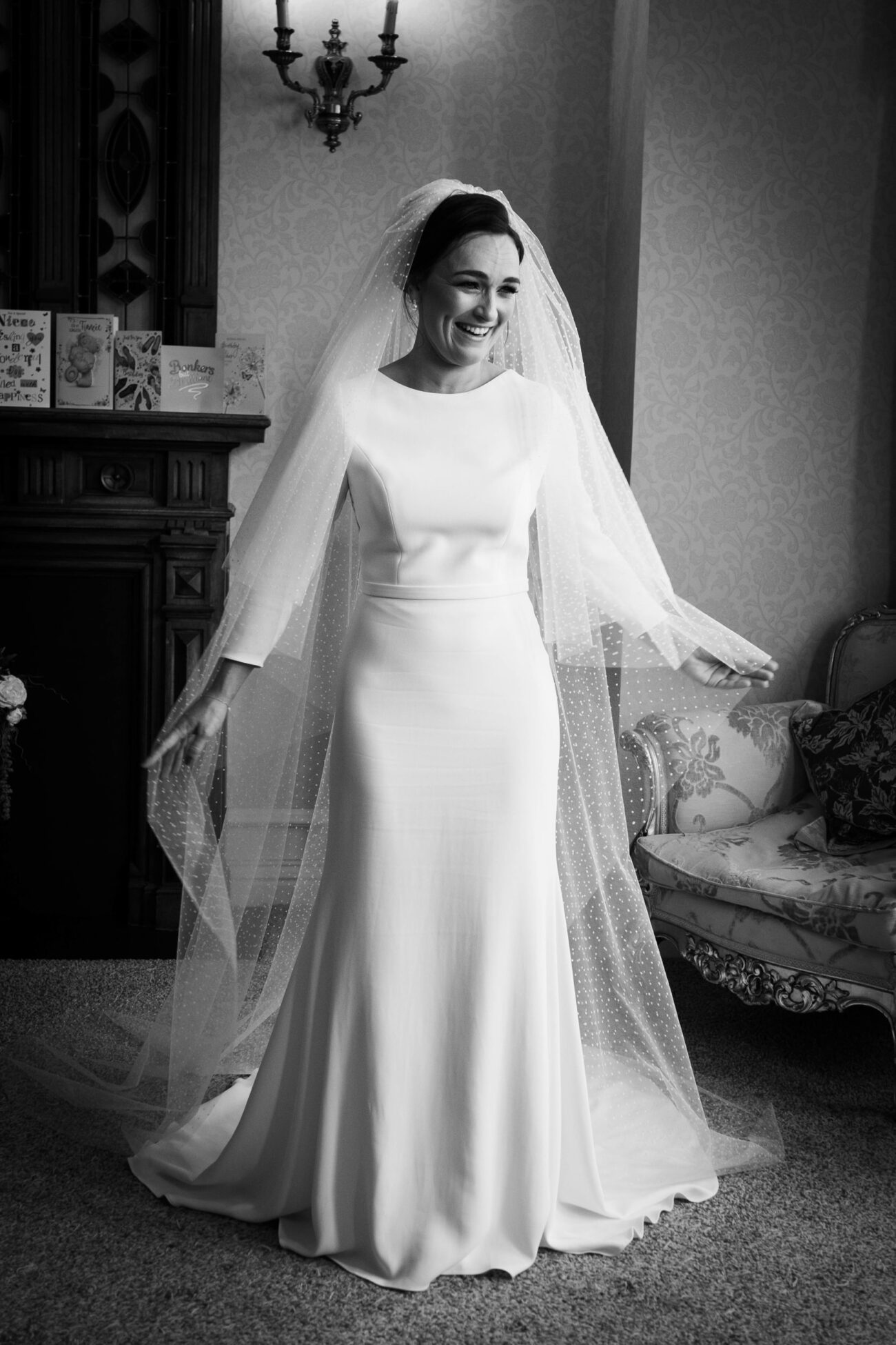 Bride smiling and all ready to go in the bride suite of Kilronan Castle 