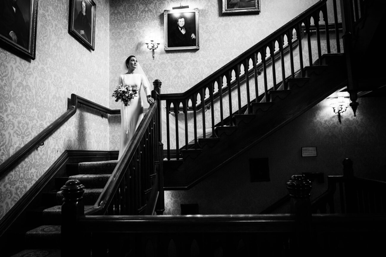 Bride walking down the stairs at Kilronan Castle wedding
