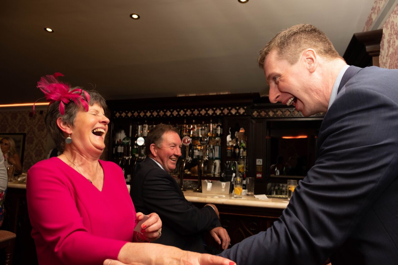 candid wedding photography, magician with guest at wedding at Kilronan Castle