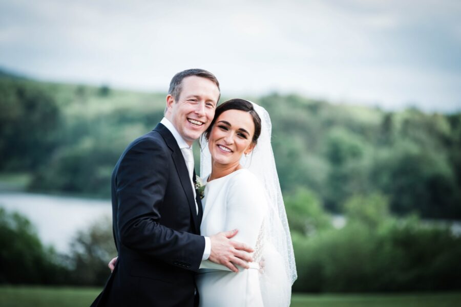 Bride and groom embracing in the gardens of Kilronan Castle