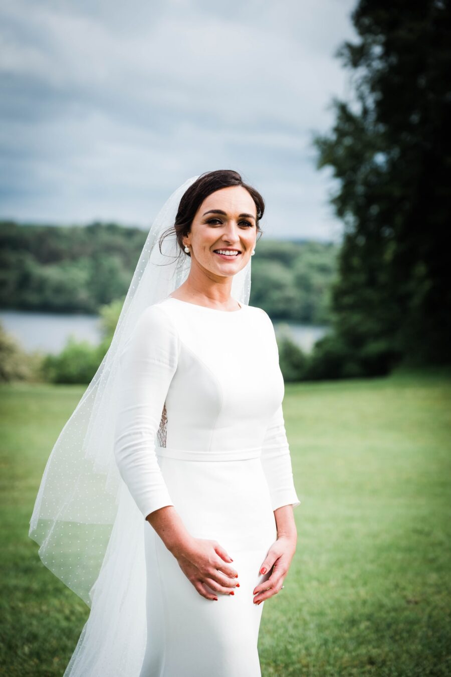 bride standing alone in the gardens on Kilronan Castle