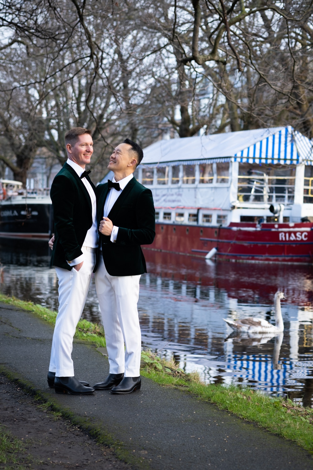 couple standing by the boats at the canal in dublin 2, destination wedding in Dublin