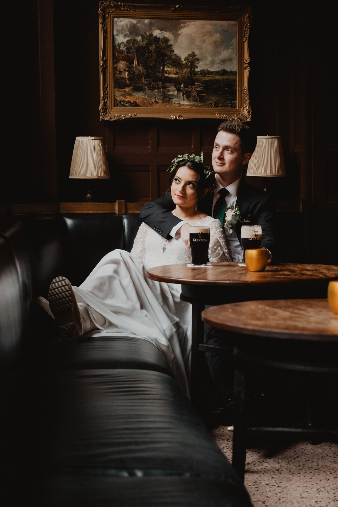 Bride and groom looking out the window in the Oak Bar at The Clarence Hotel, wedding at The Clarence Hotel