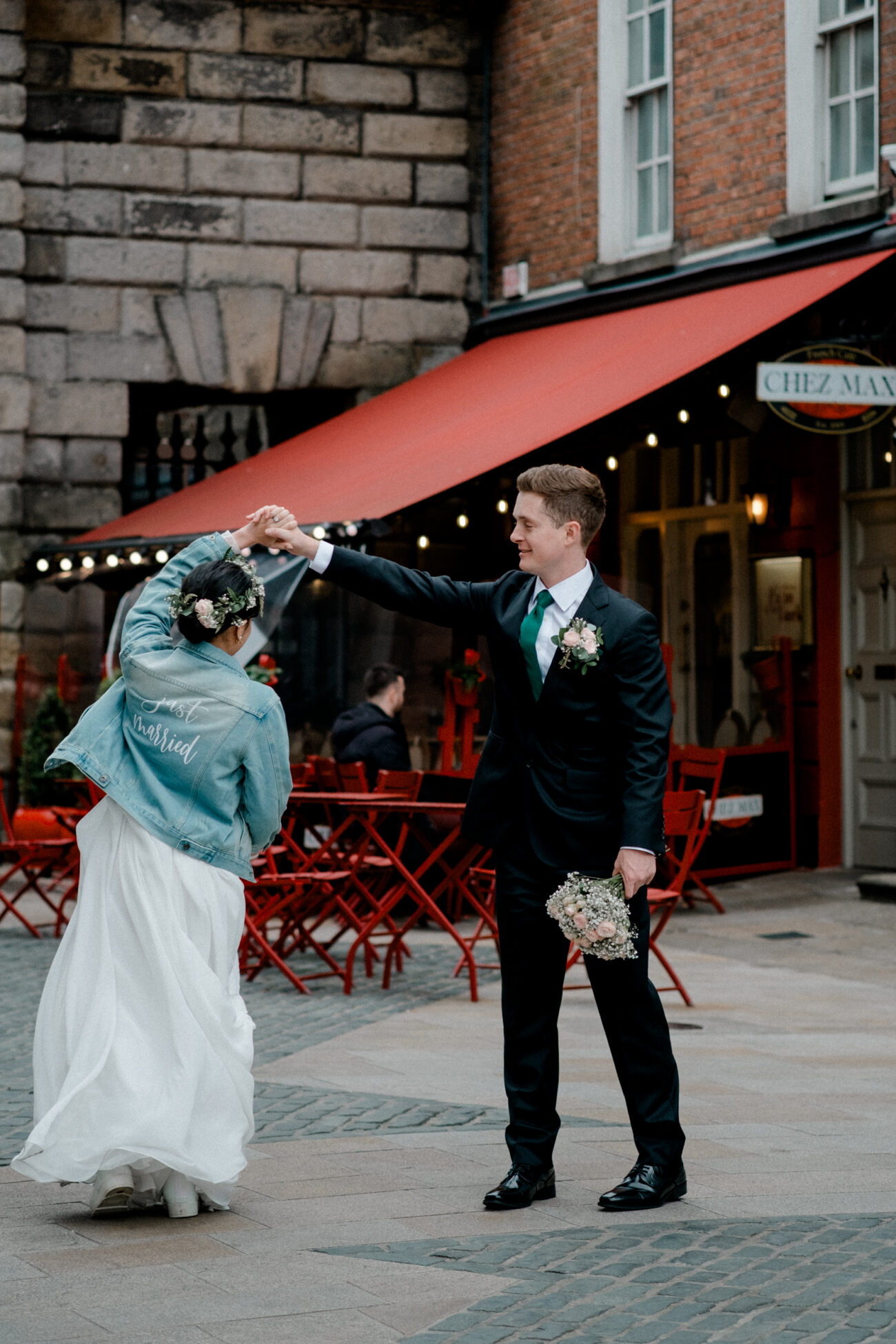 Couple dancing in front of Chez Max in Temple Bar. Dublin elopement