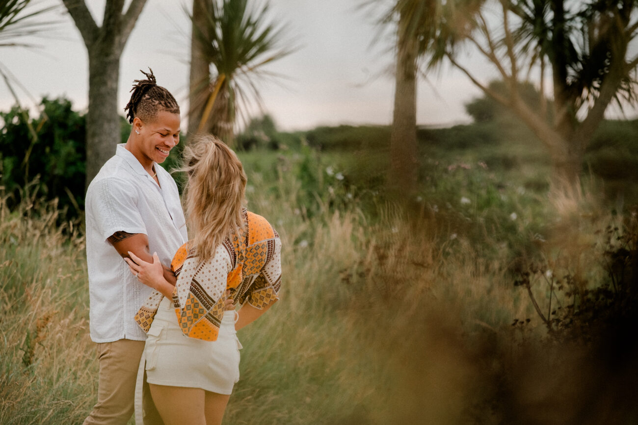 couple dancing and looking at each other during an engagement shoot in Howth Summit