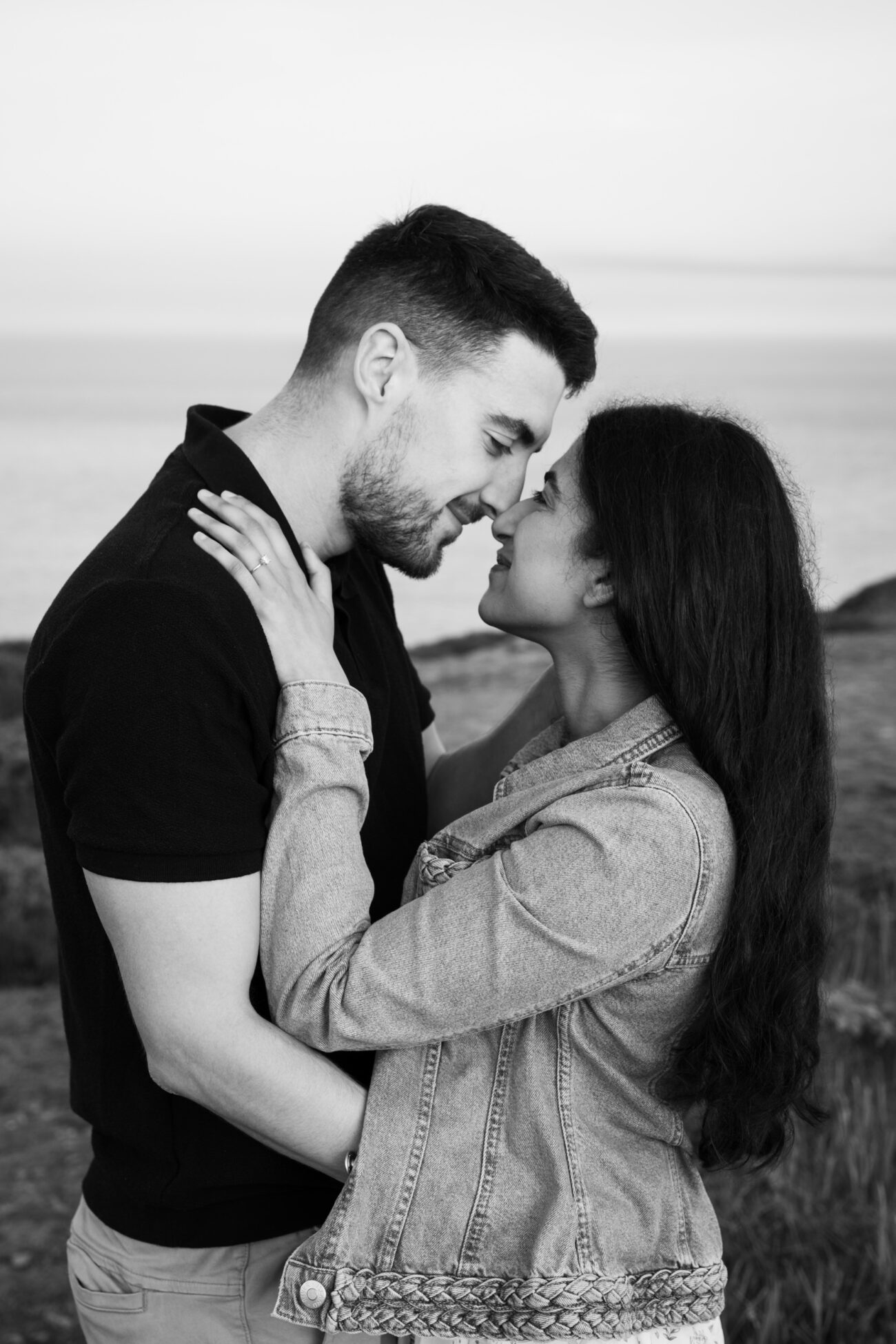 couple facing each other and staying close at Howth Summit