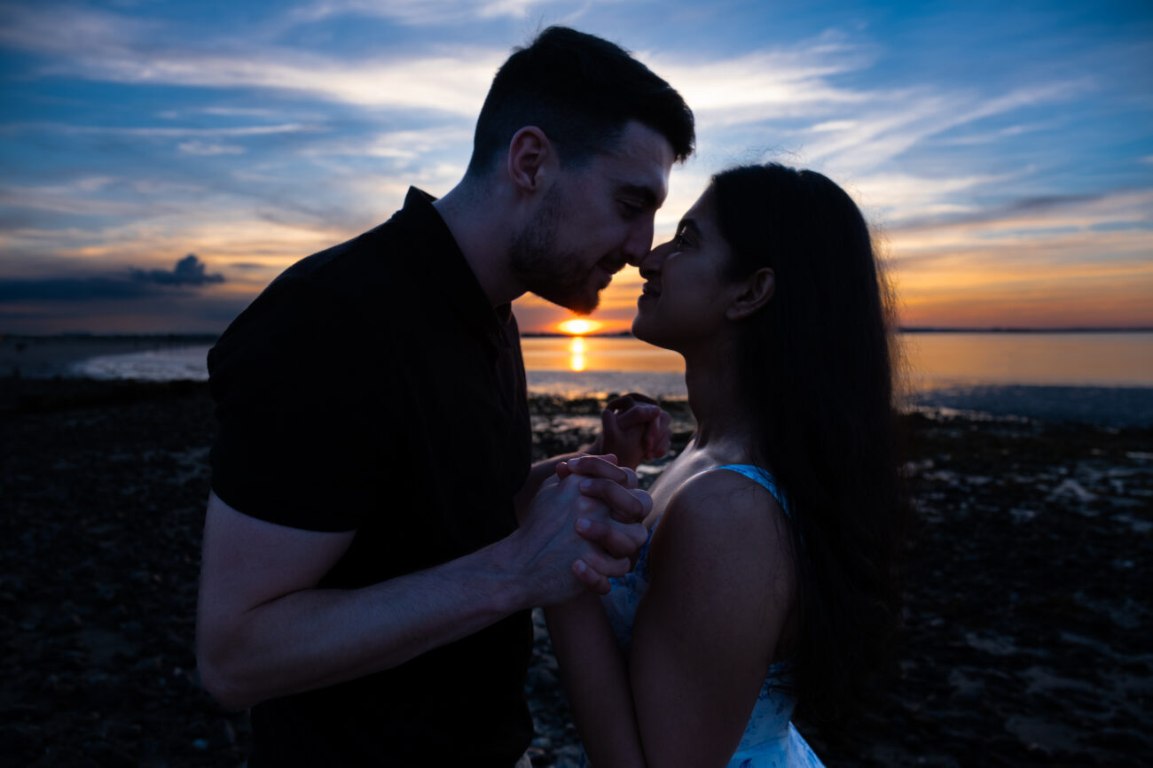 silhouette of couple holding hands at Burrow Beach