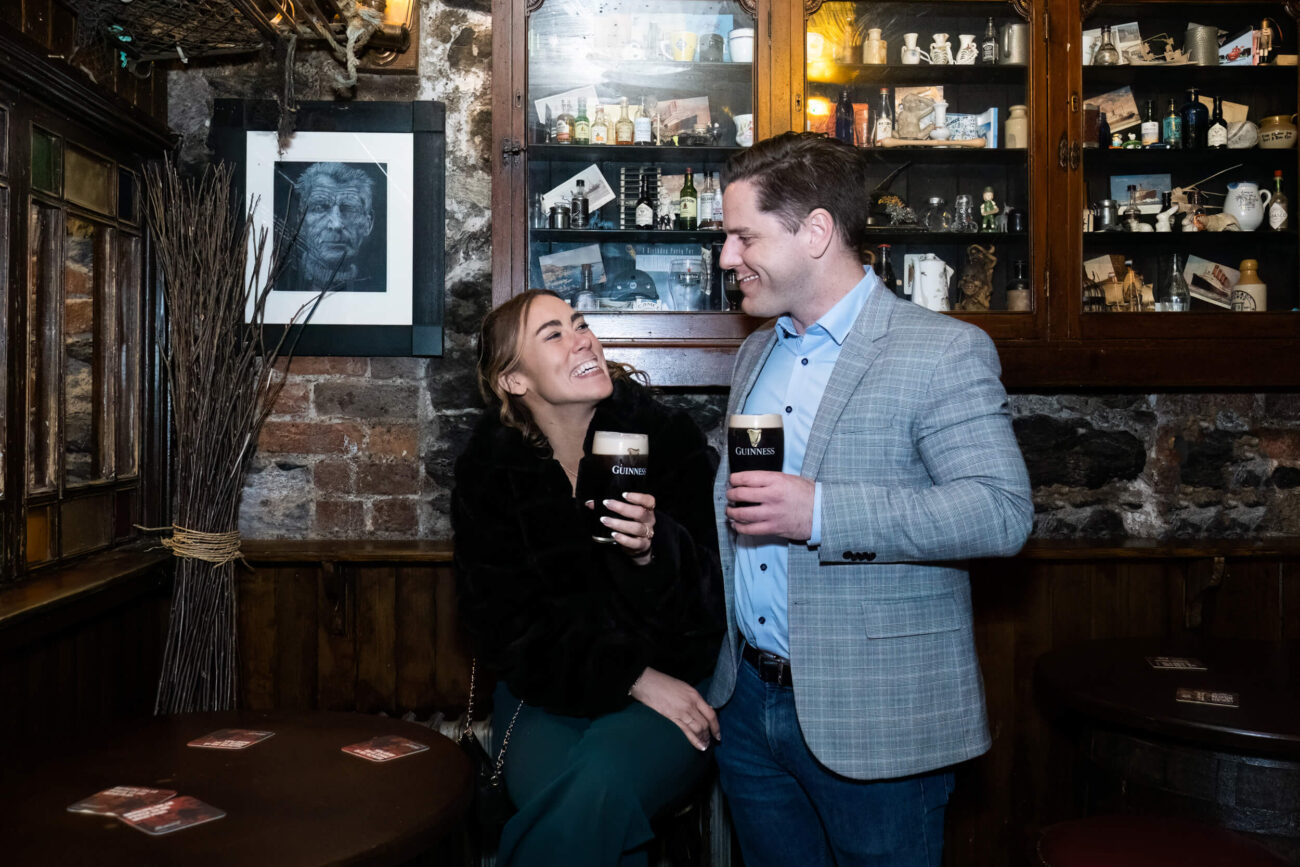 Couple drinking a pink of Guinness at The Bloody Stream in Howth