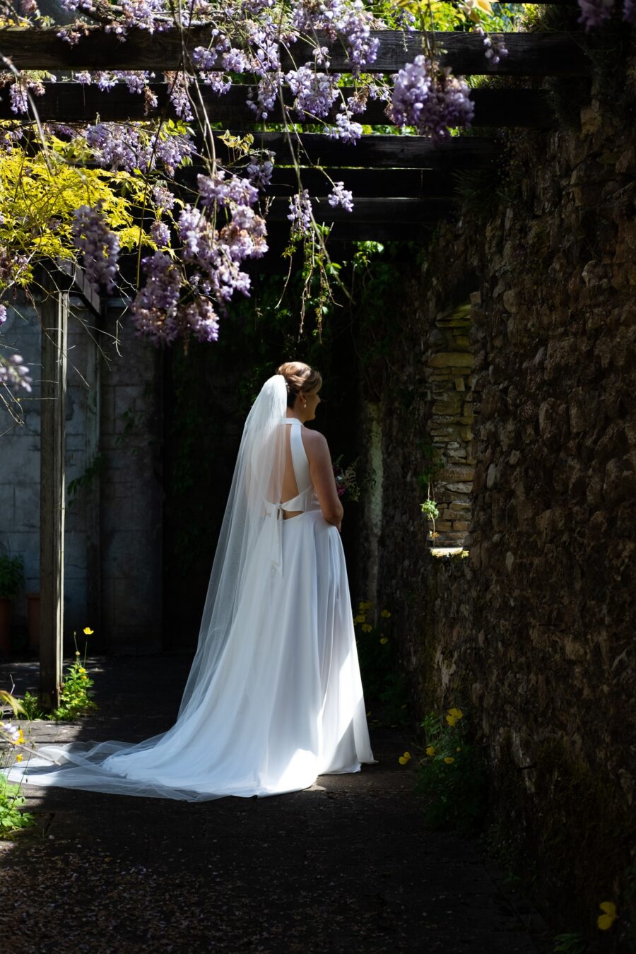 Bride standing in the courtyard at roundwood House