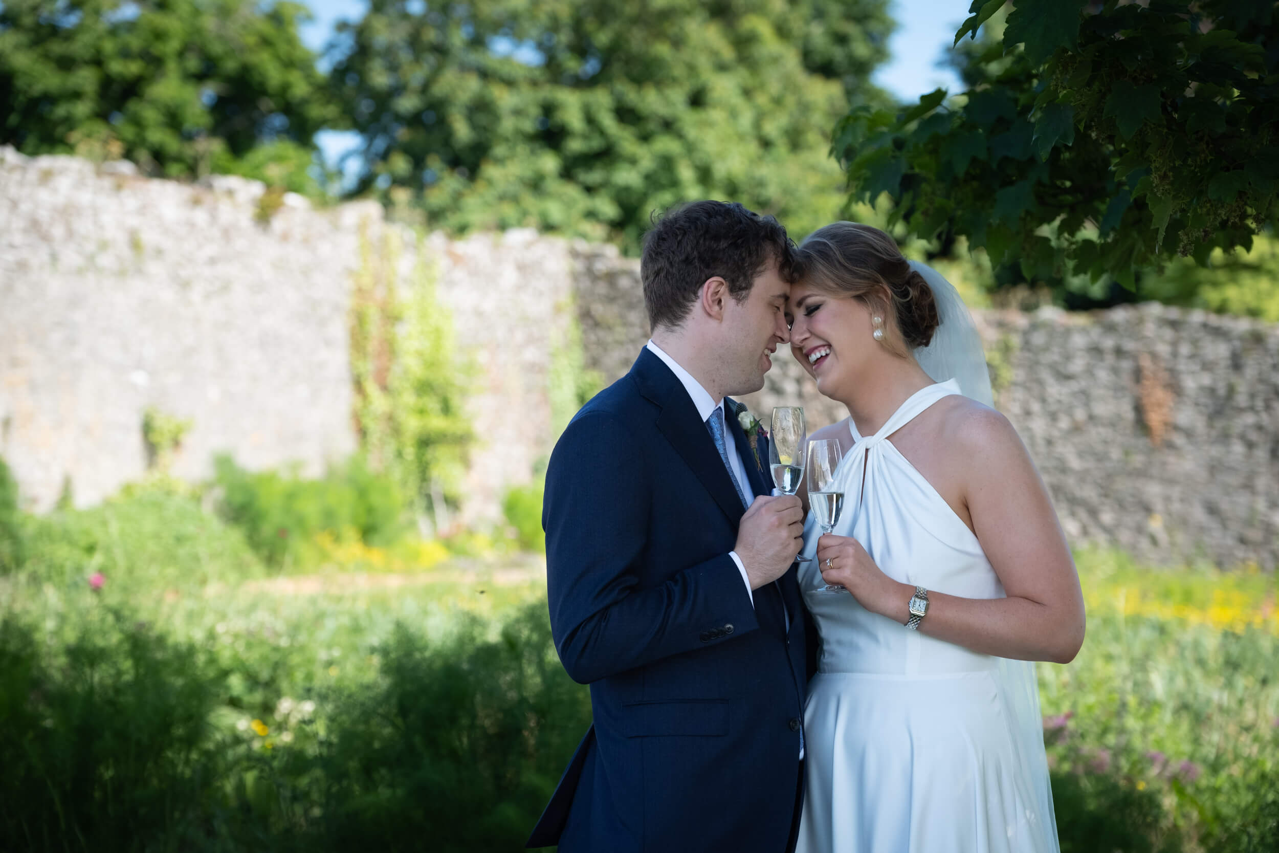Couple facing each other closely in the gardens of Cloughjordan House