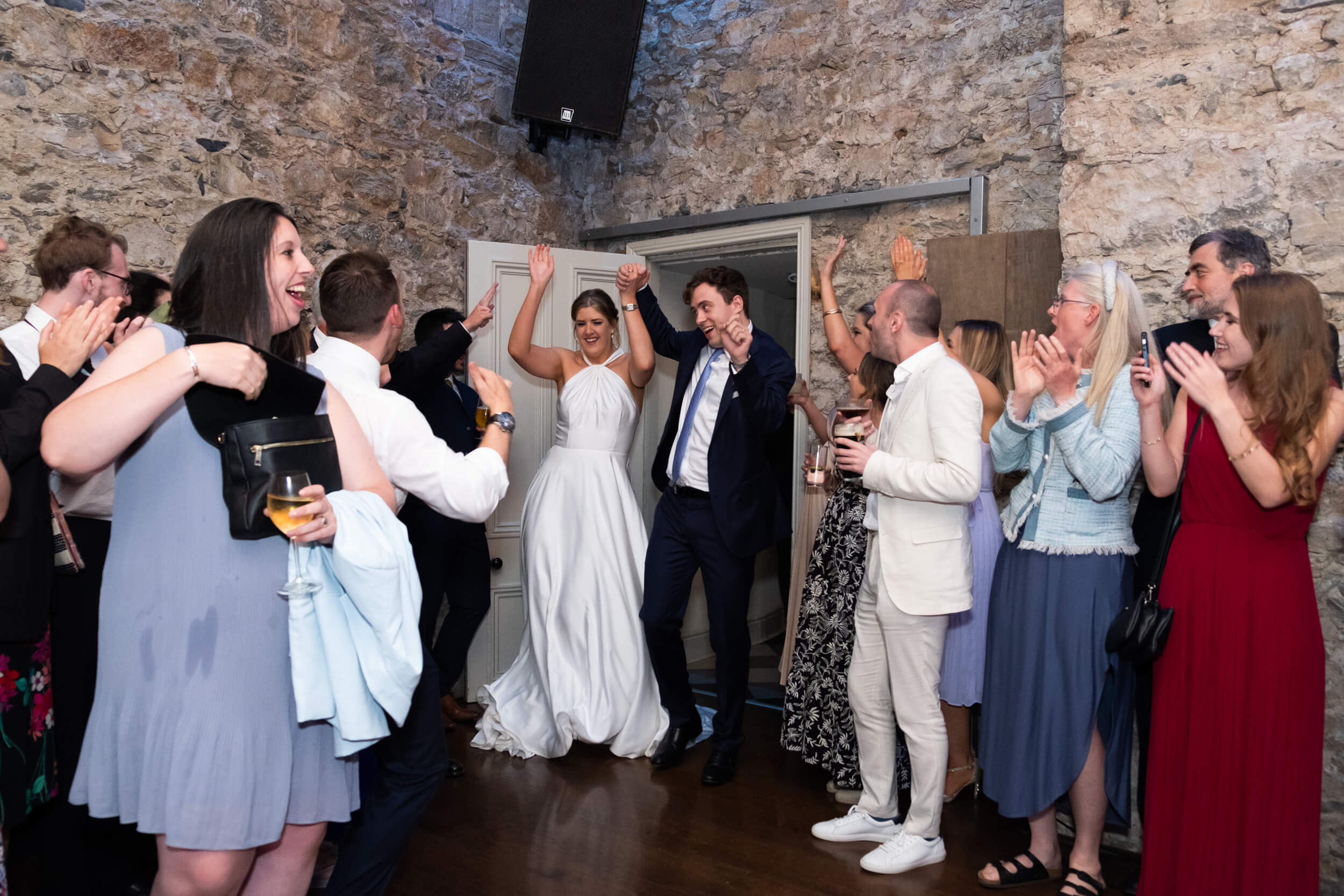 Couple walking into first dance at Cloughjordan House