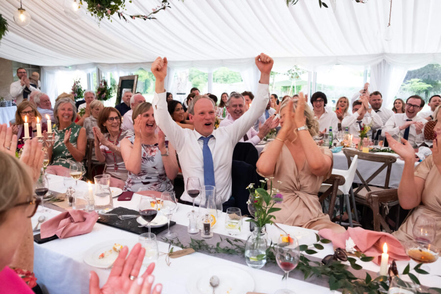 Guests putting his hands up in the air in celebration at the speeches at Cloughjordan House