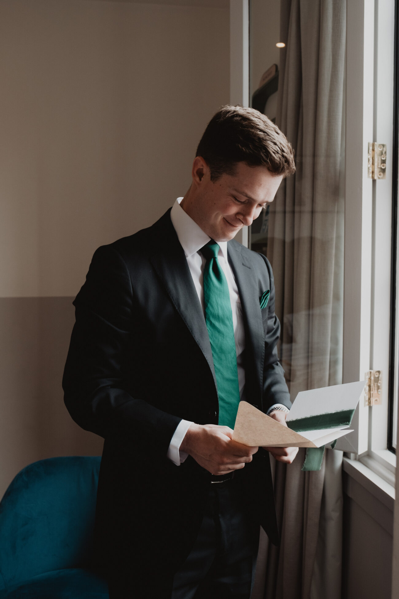 Groom reading his letter from the bride at The Clarence Hotel