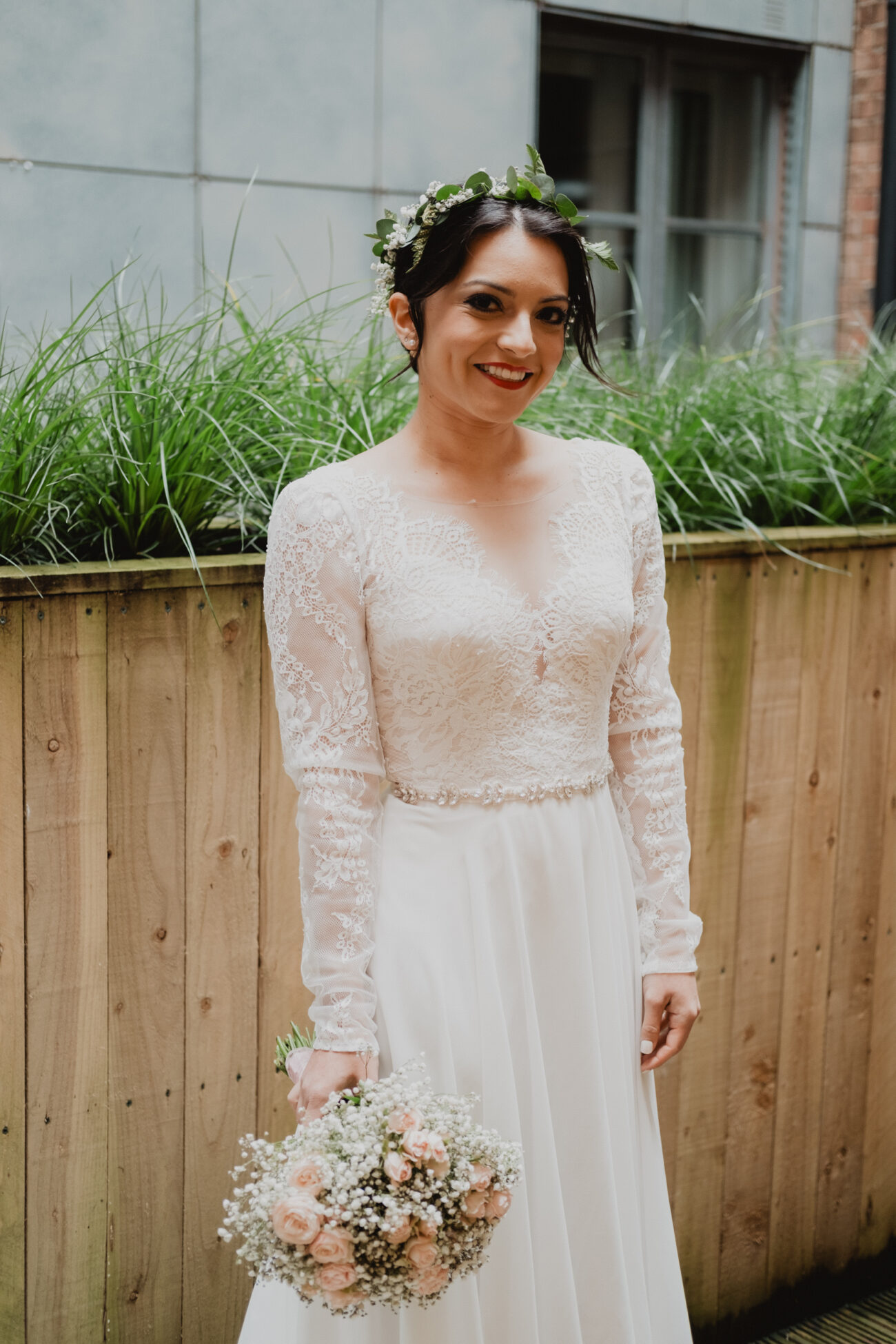 Bride posing in her wedding dress at The Clarence Hotel