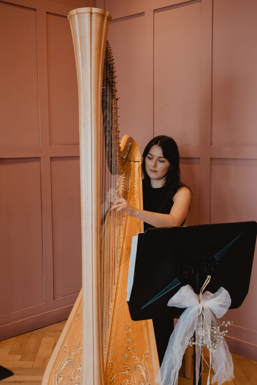 Clara Booth Harpist playing in Rose Room at The Clarence Hotel