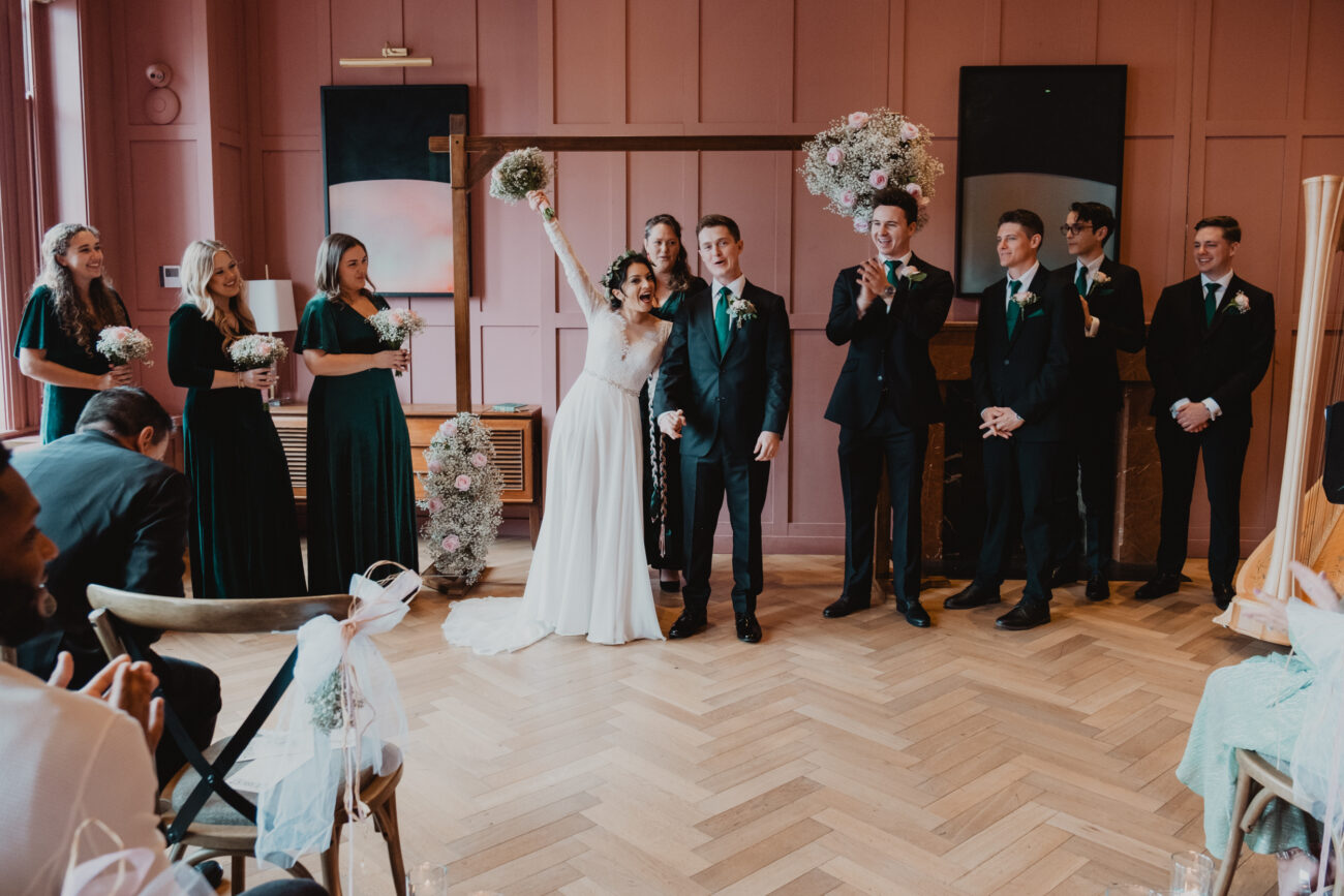 Bride and groom ready to walk down the aisle at The Clarence Hotel