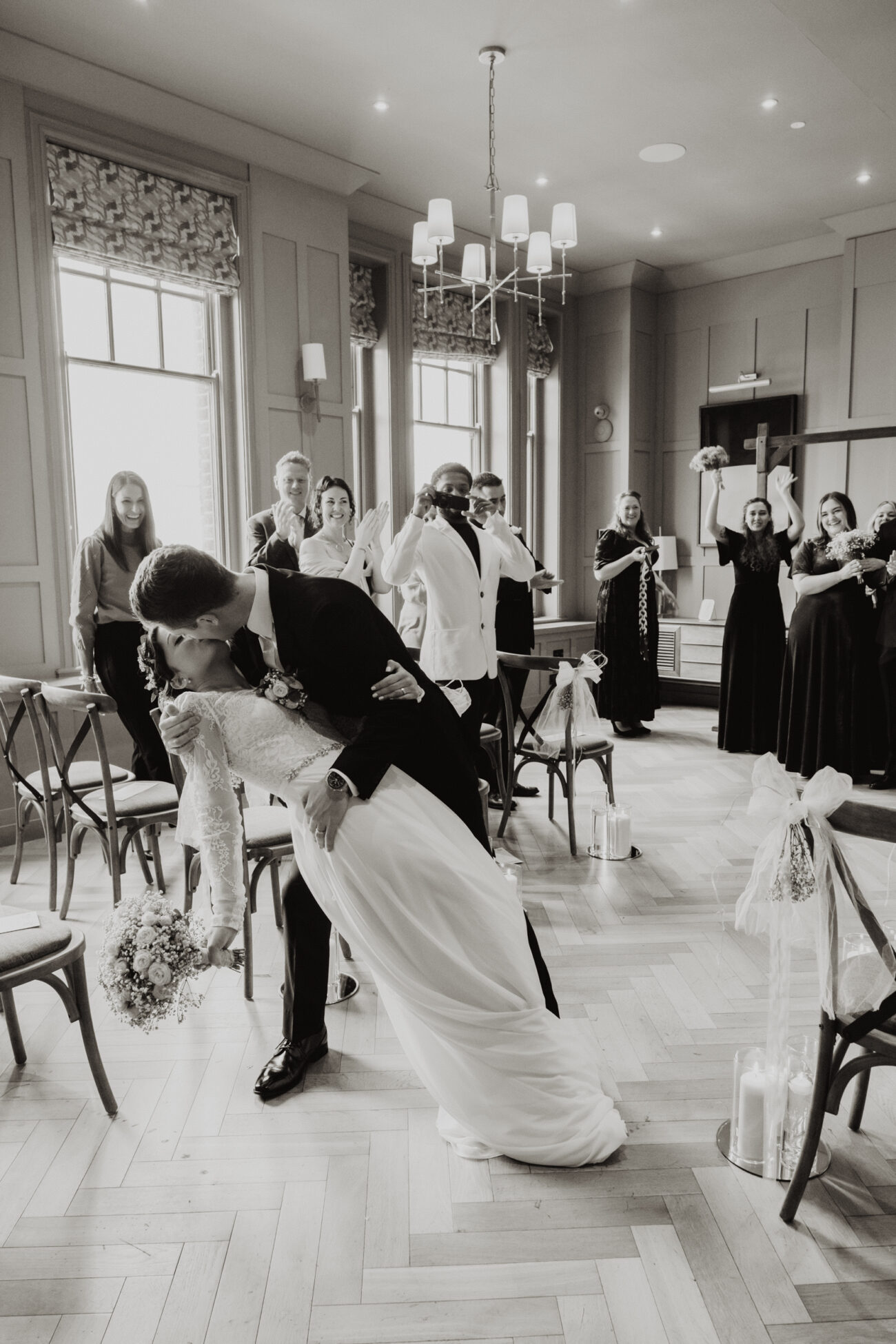 Bride and groom doing a dip kiss in The Rose Room of the Clarence Hotel