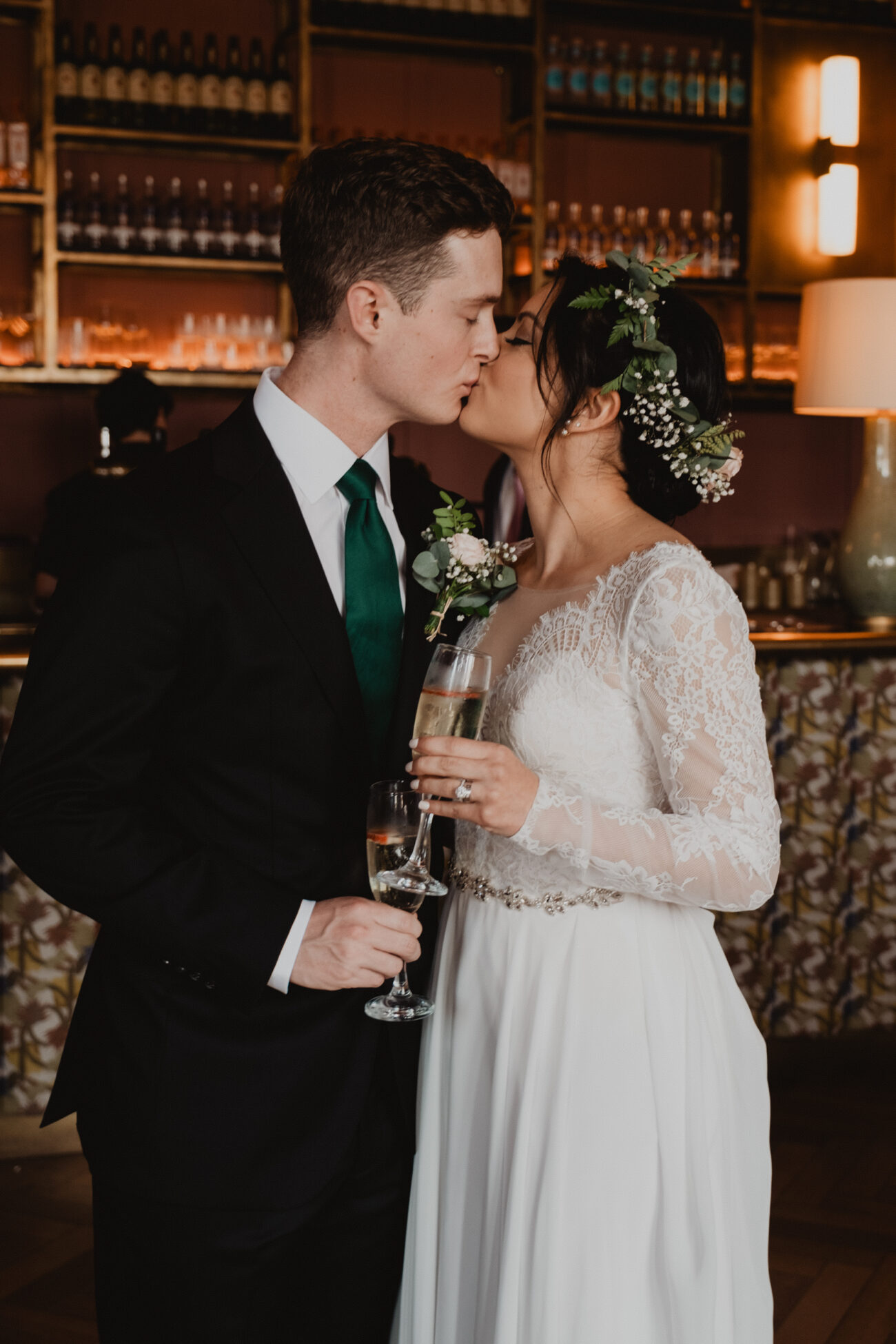 bride and groom kissing during cocktail hour at The Clarence hotel, Clarence Hotel wedding