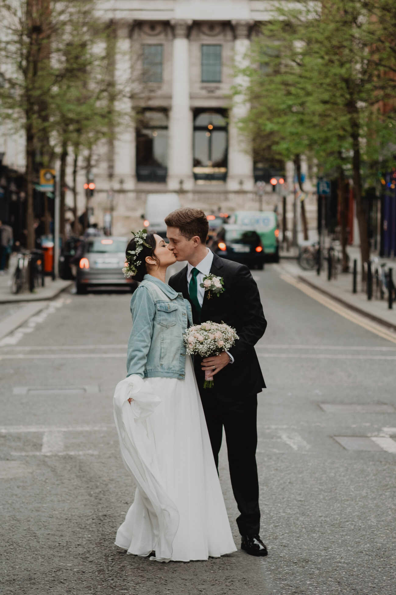 Bride and groom kissing on Parliament Street, wedding at The Clarence Hotel, Dublin City wedding, Elopement in Dublin city