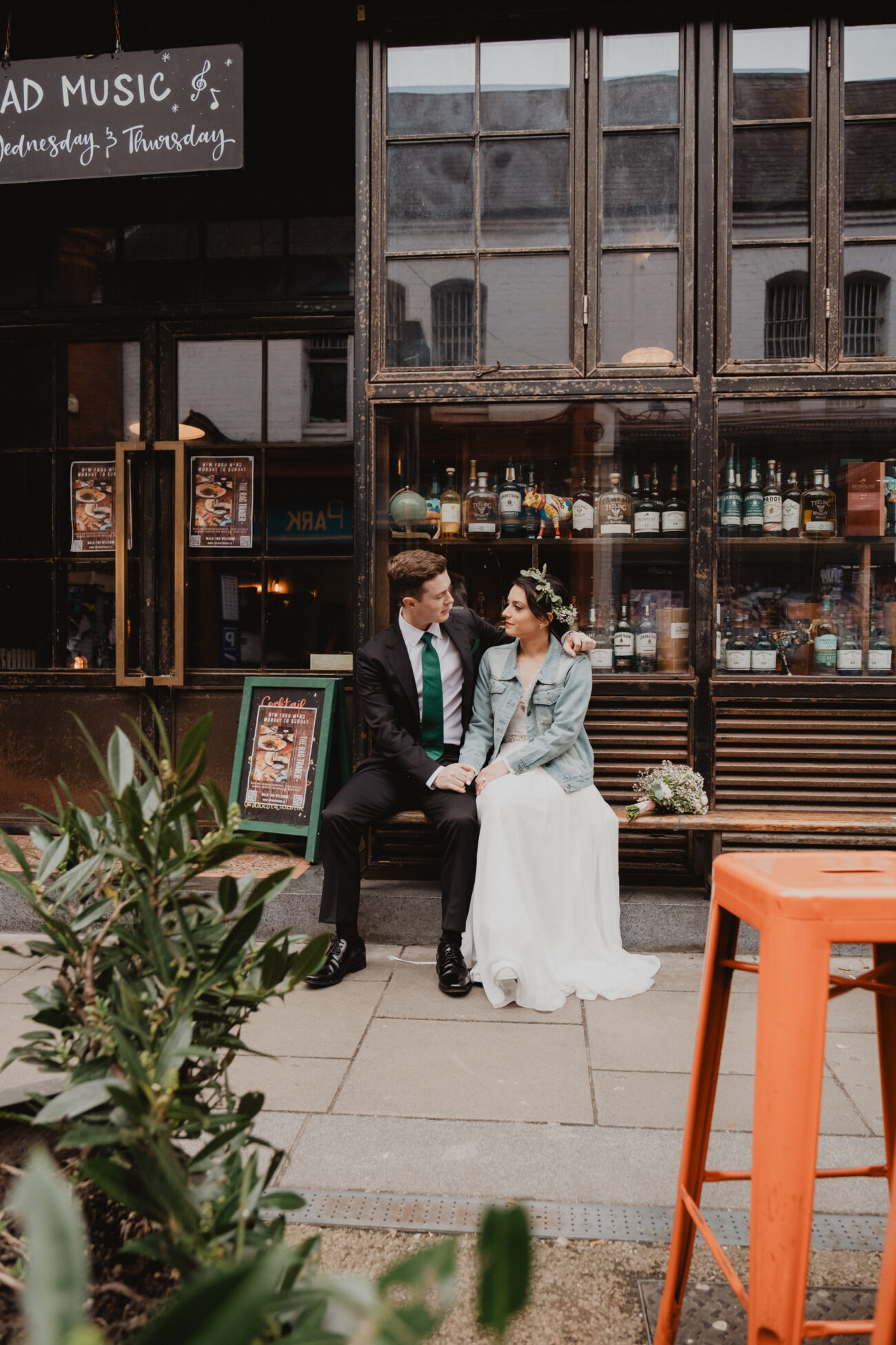 couple sitting outside the Rag Trader Pub on Drury Street in Dublin, elopement in Dublin, Dublin city weddings