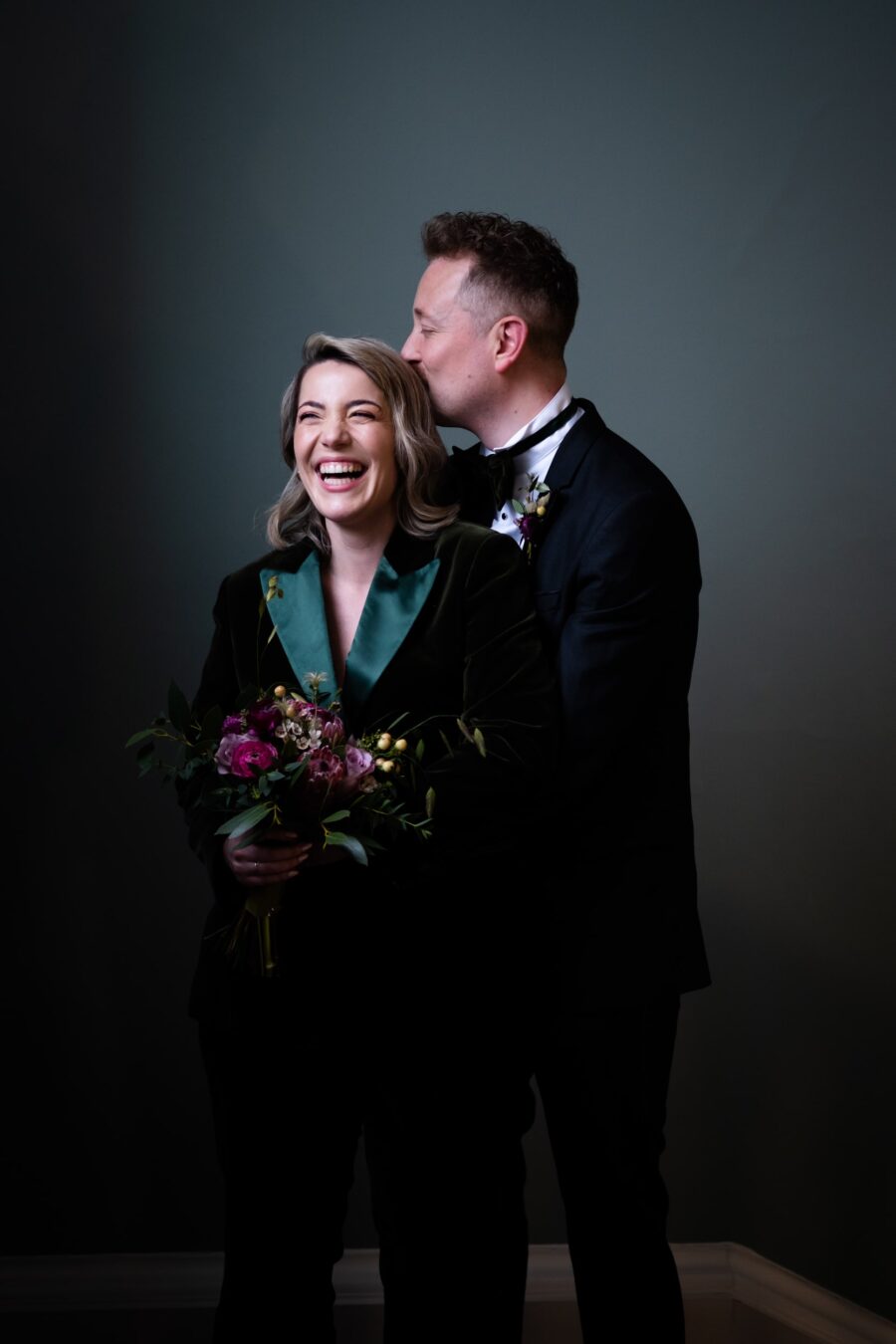 wedding at The National Gallery of Ireland. Couple laughing at the stairway