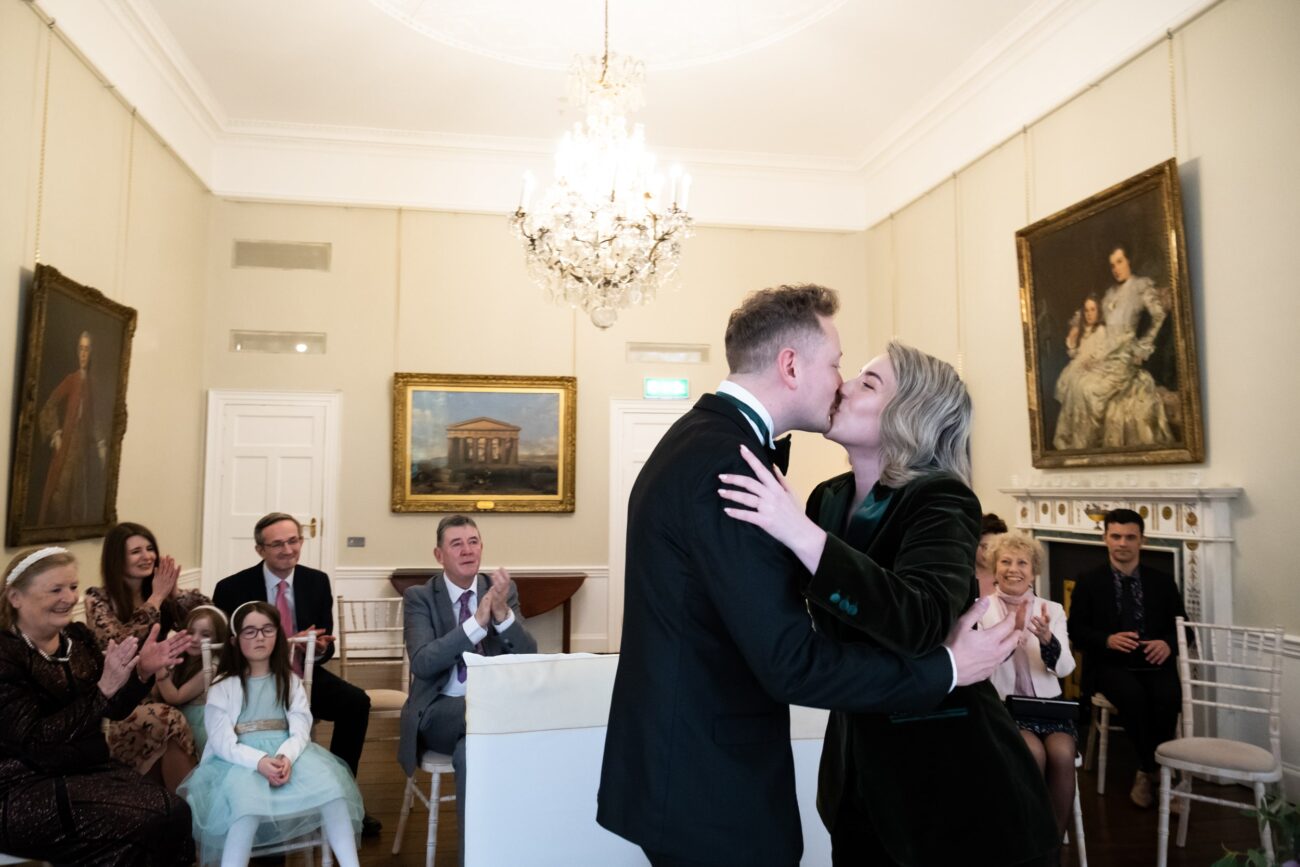 Bride and groom kissing at a wedding at The National Gallery of Ireland