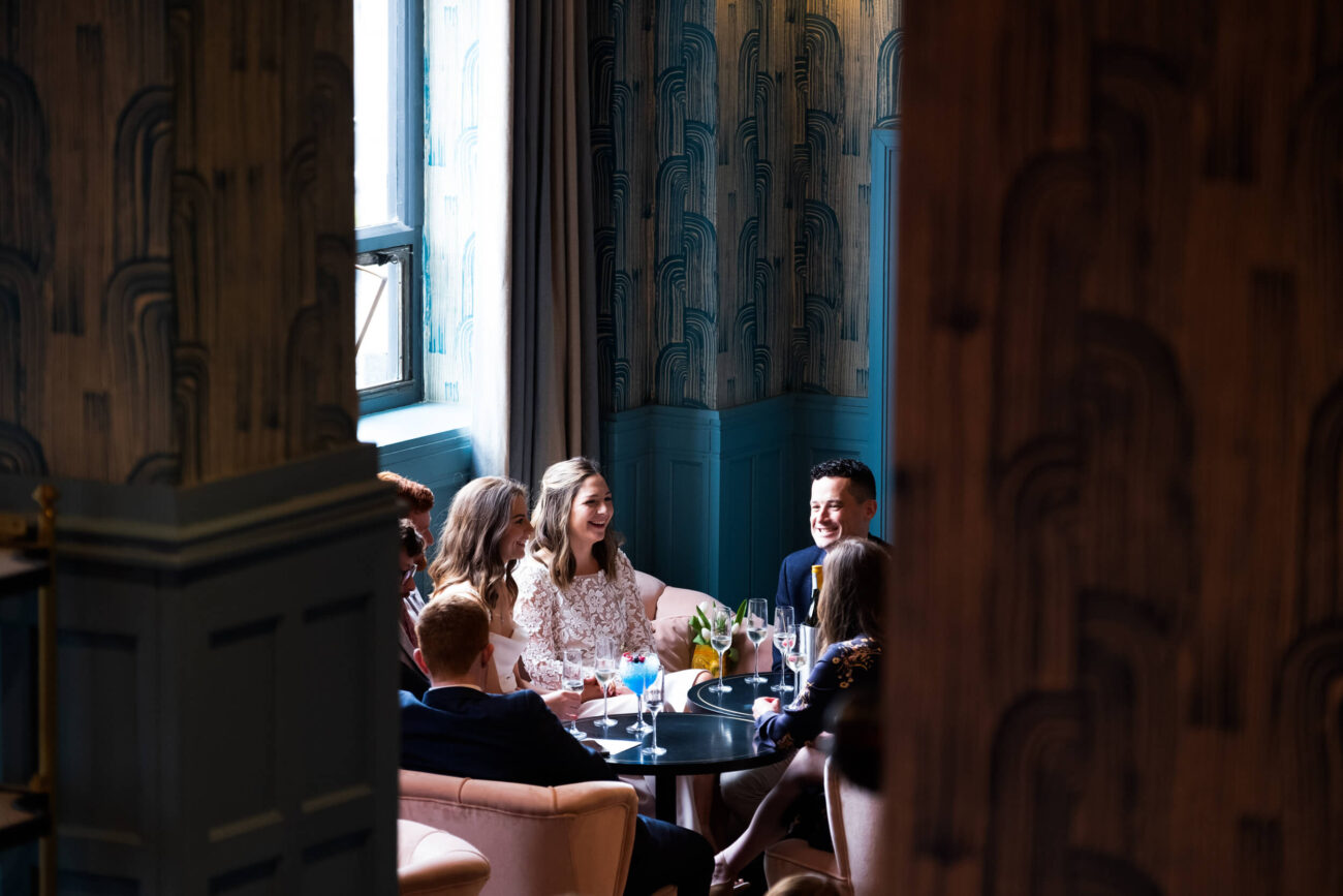 Couple sitting with their friends at The bar of The Clarence Hotel