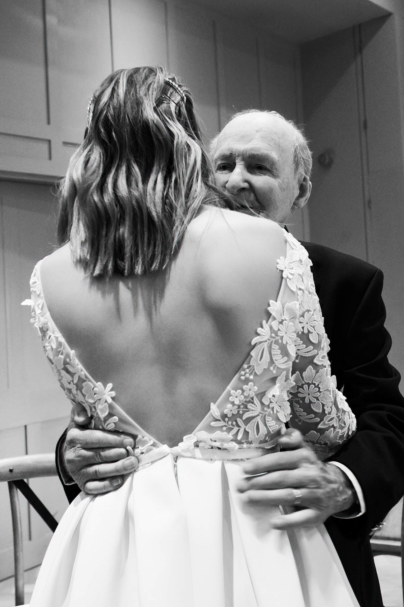 Grandfather congratulating his granddaughter at her wedding ceremony at The Clarence Hotel