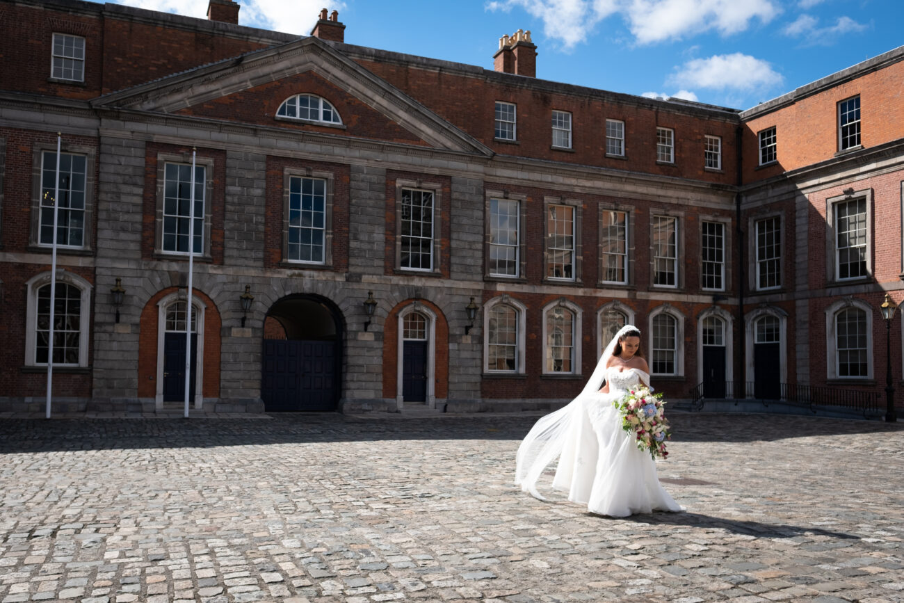 Bride walking alone on the grounds of Dublin Castle, Dublin City Wedding