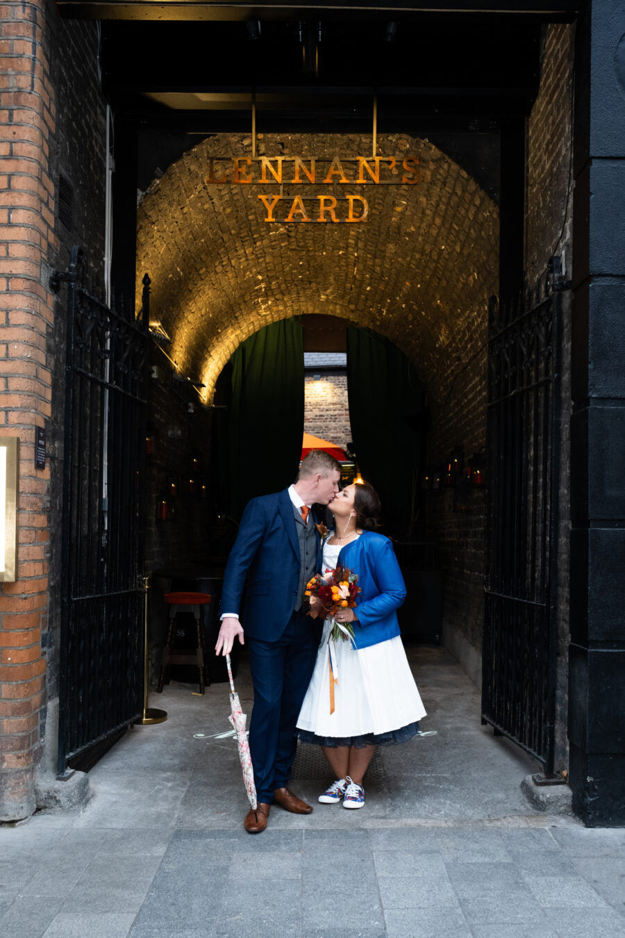 couple kissing outside the front of Lennans Yard