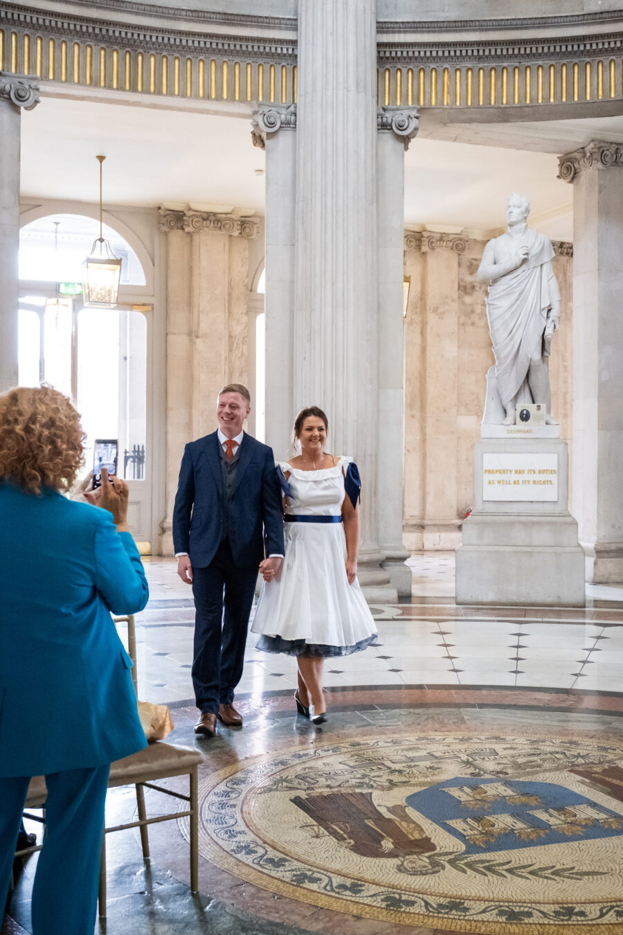 couple walking down the aisle of Dublin City Hall, Dublin City Hall wedding