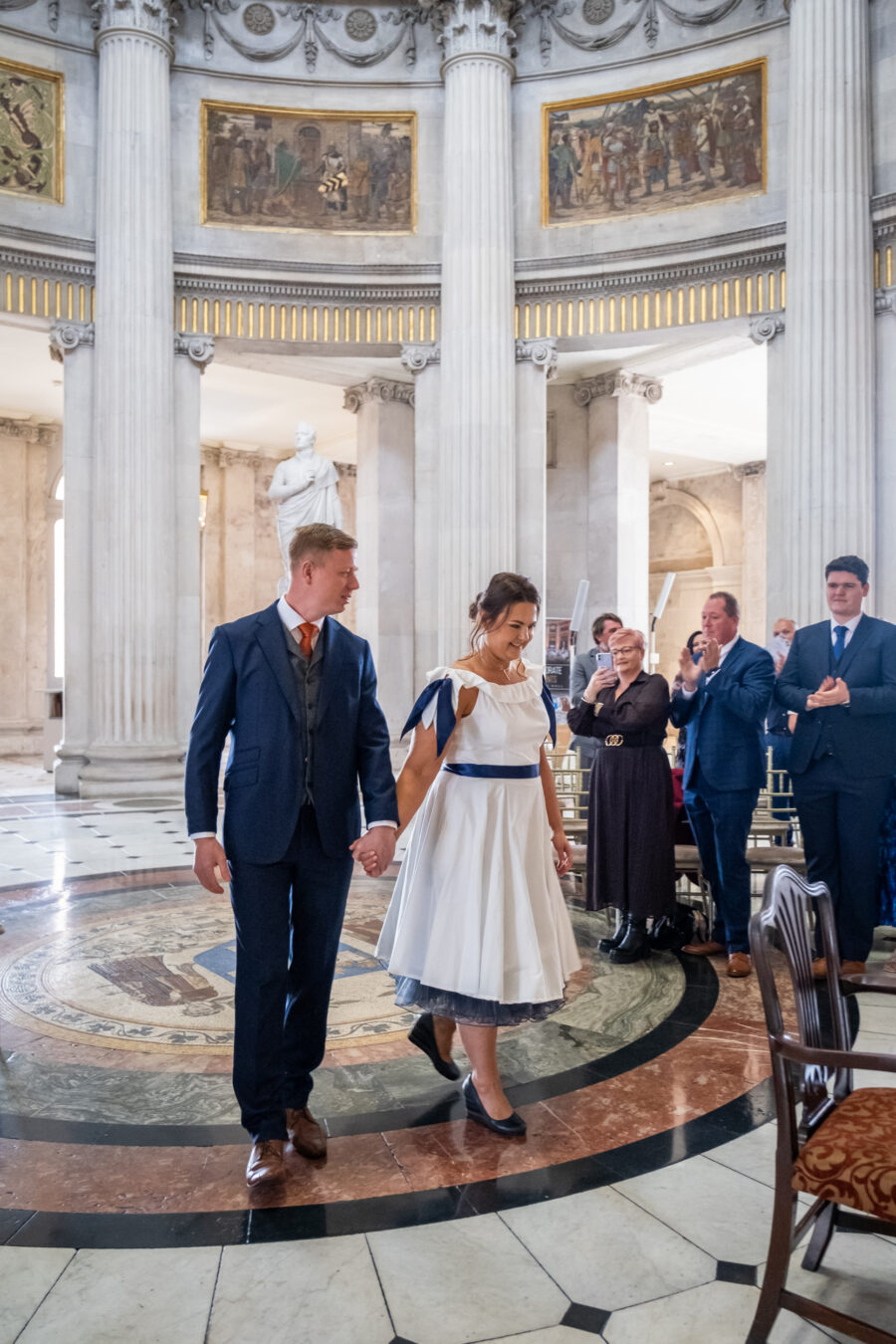 couple walking down the aisle of Dublin City Hall, Dublin City Hall wedding