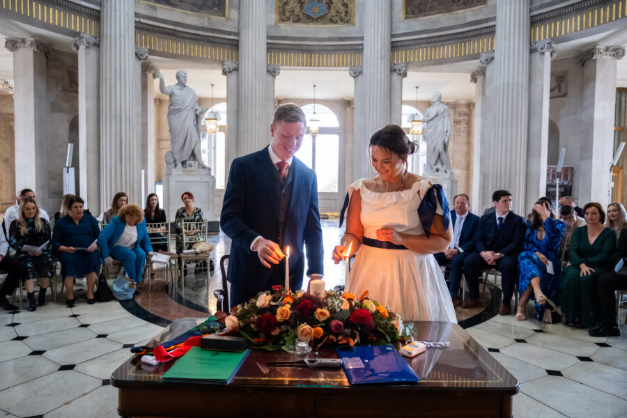 couple blowing out the wedding candle at Dublin City Hall, Dublin City Hall wedding