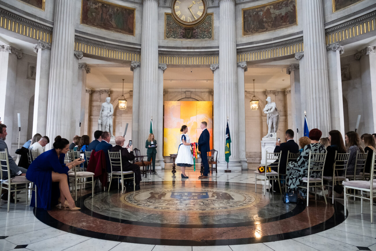 wide shot of couple facing each other during ceremony in Dublin City Hall