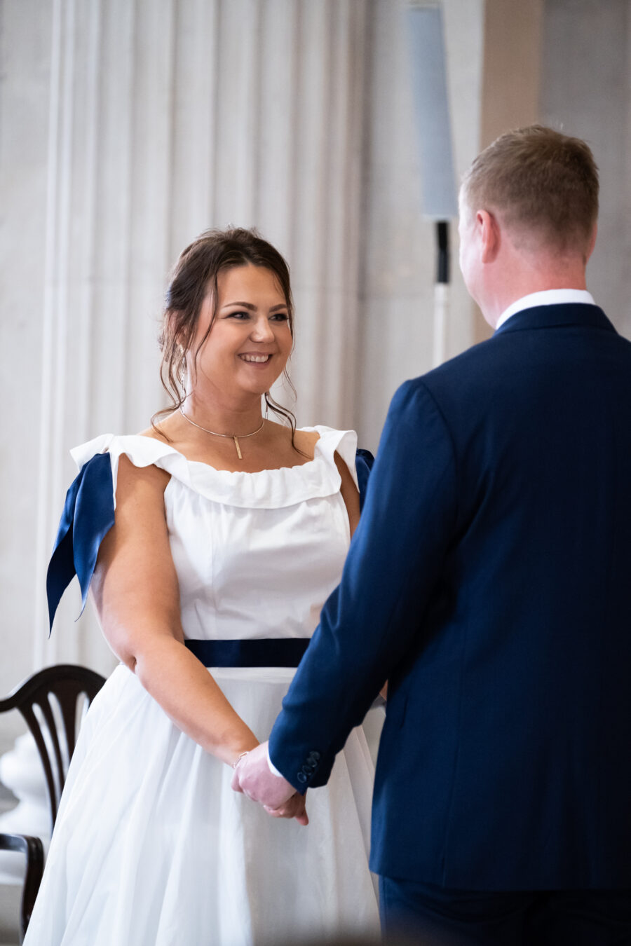 bride smiling the groom during ceremony of Dublin City Hall