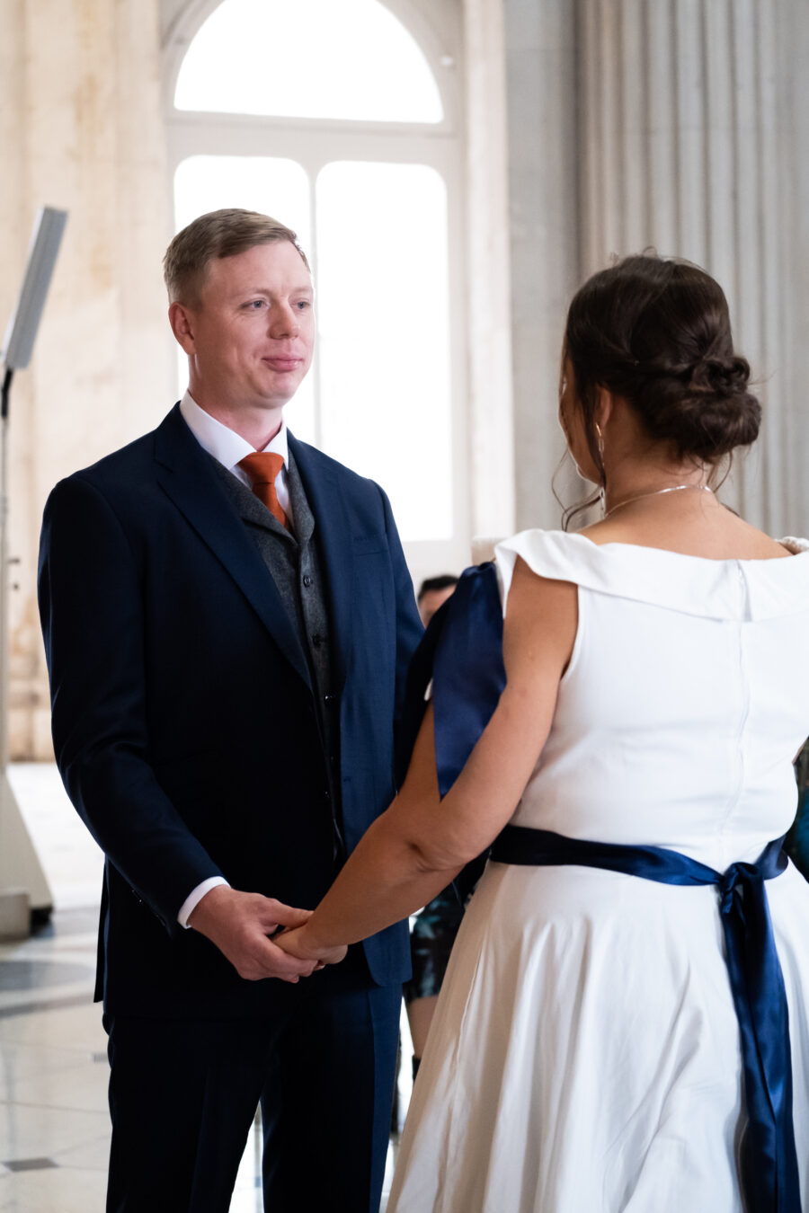 groom smiling at the bride during ceremony of Dublin City Hall