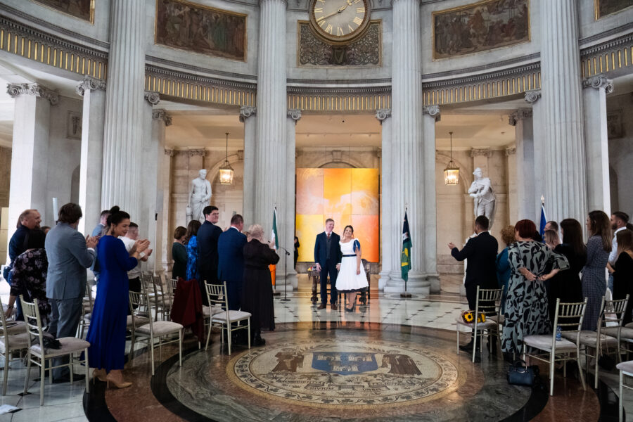 bride and groom facing their guests at Dublin City Hall