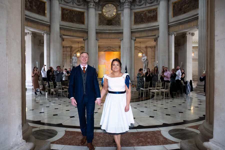 bride and groom walking down the aisle at Dublin City Hall