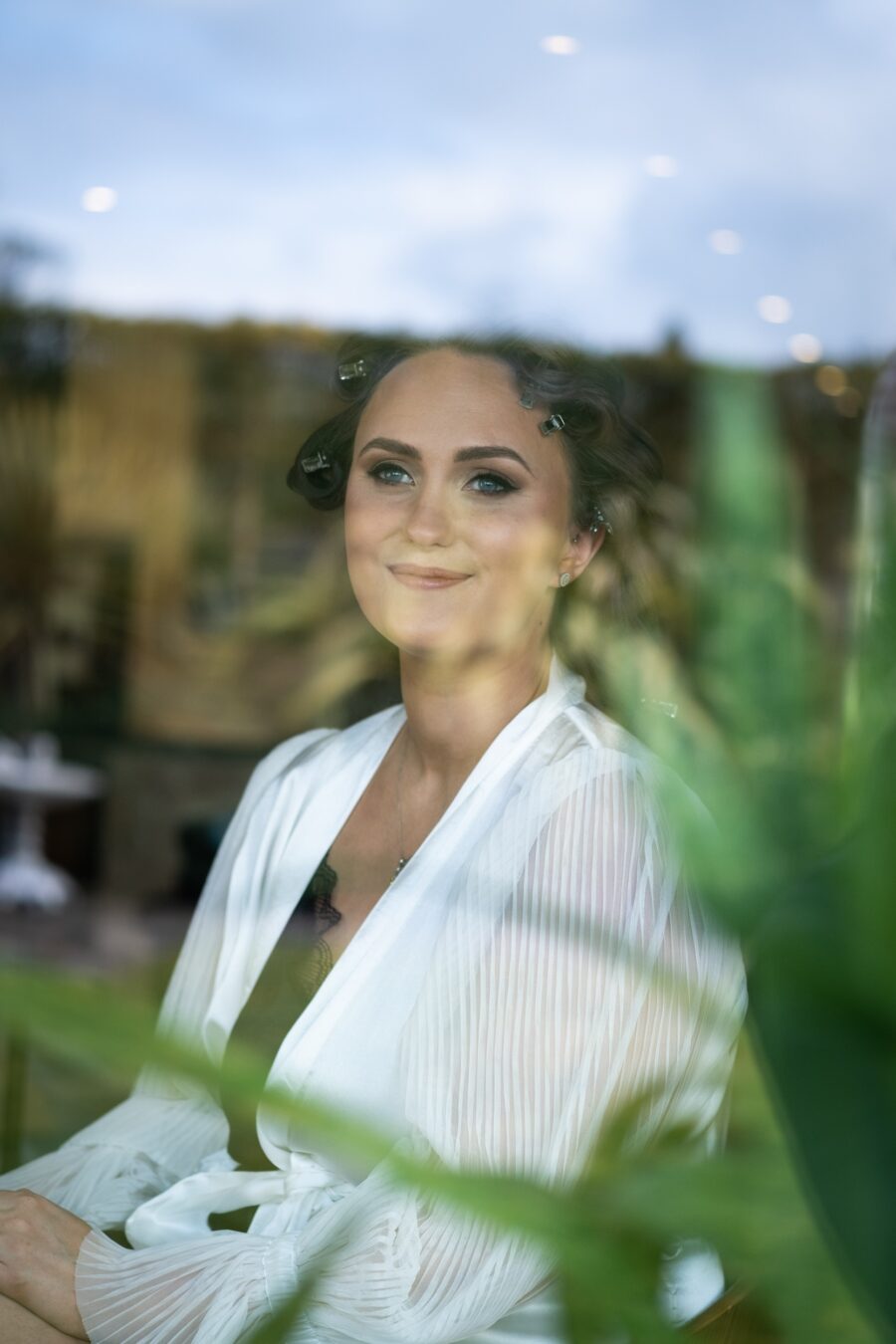 brdie looking out the window whilst getting her makeup done at Ballymagarvey Village