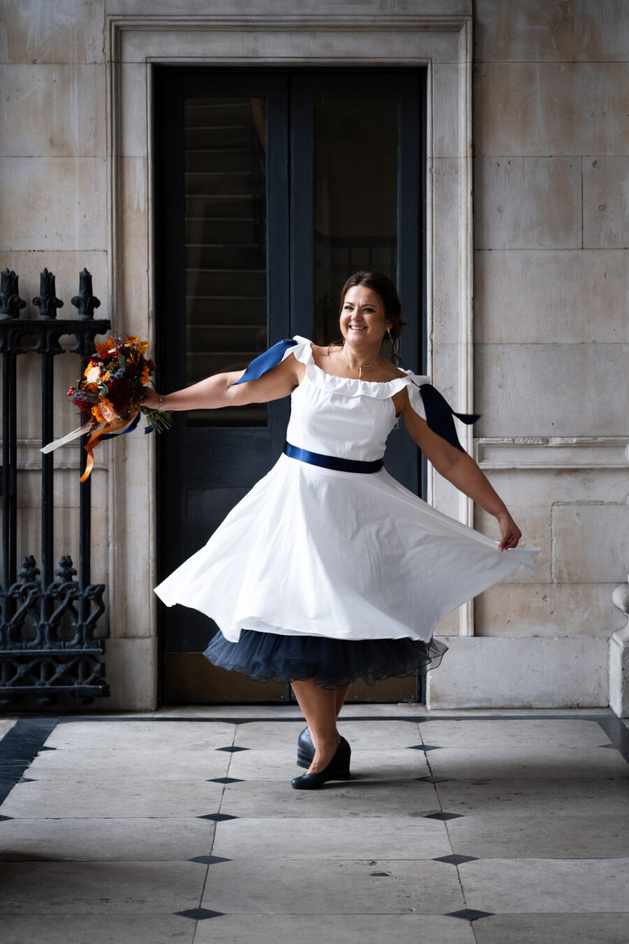 Bride spinning around at the front balcony of Dublin City Hall