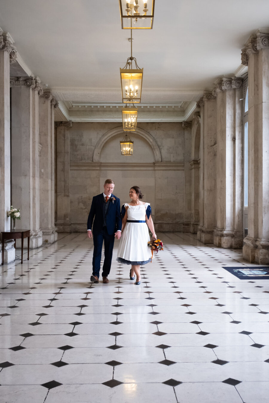 couple walking handds holding in Dublin City Hall