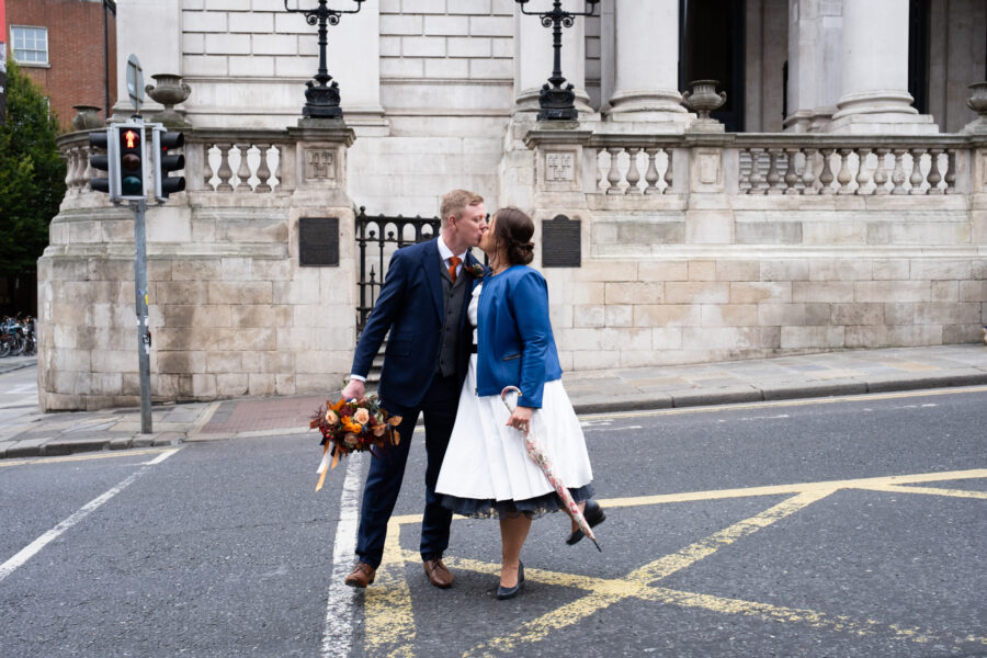 Couple kissing on the street at Dublin City Hall