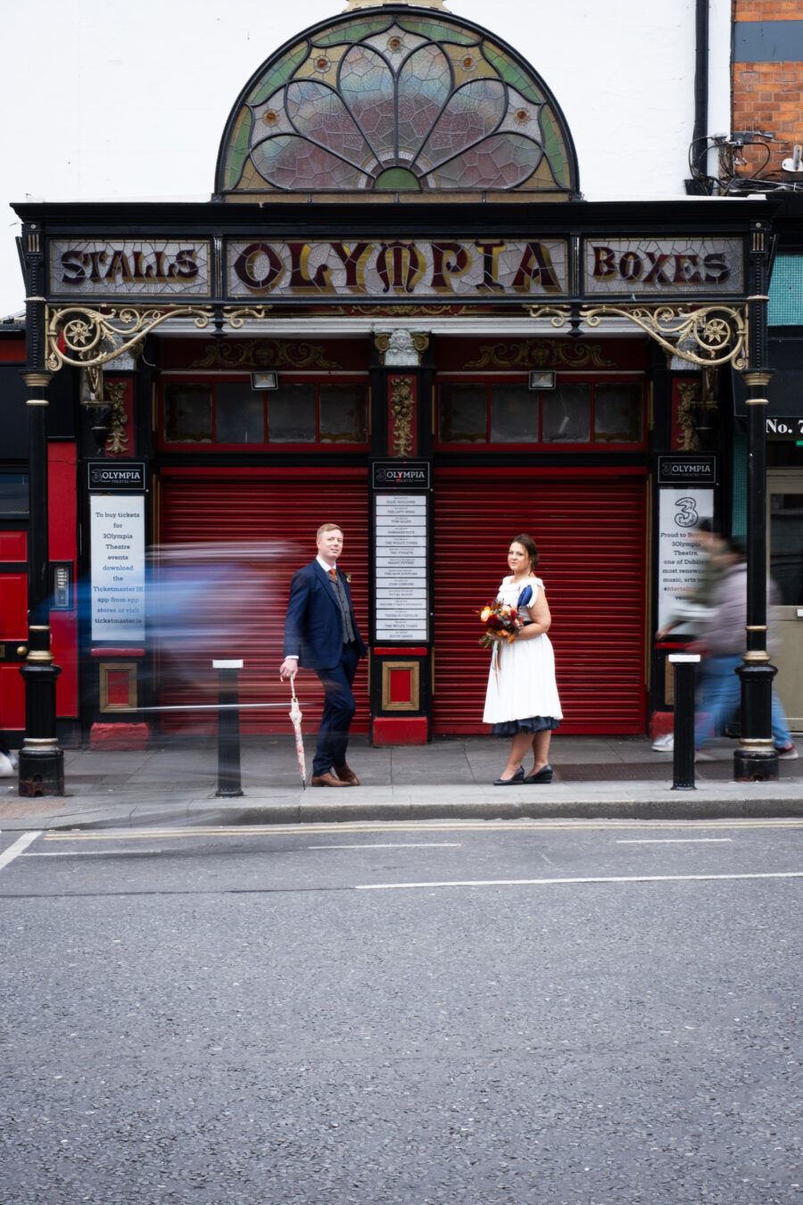 couple standing outside the Olympia Theatre