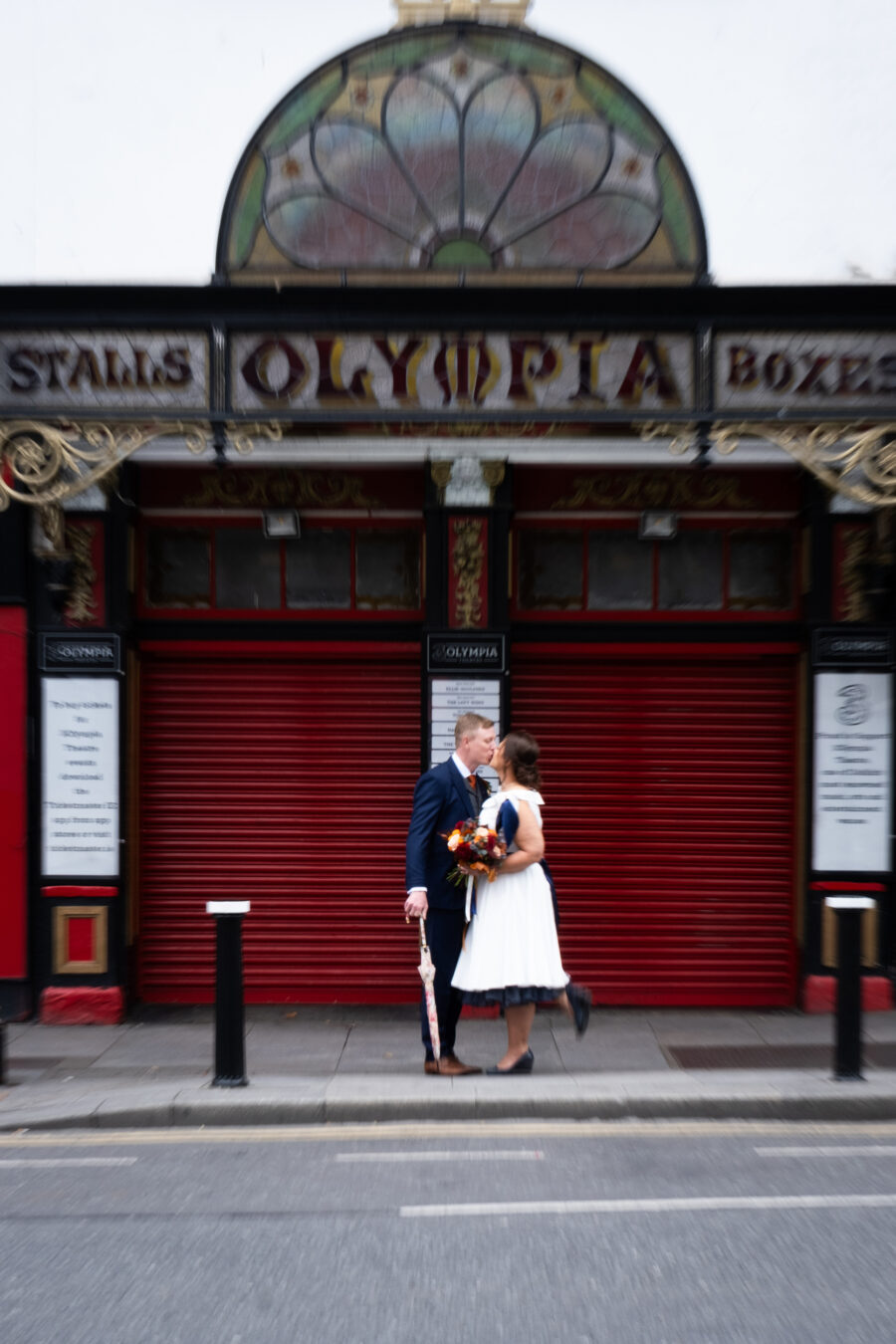 couple lissing outside the Olympia Theatre