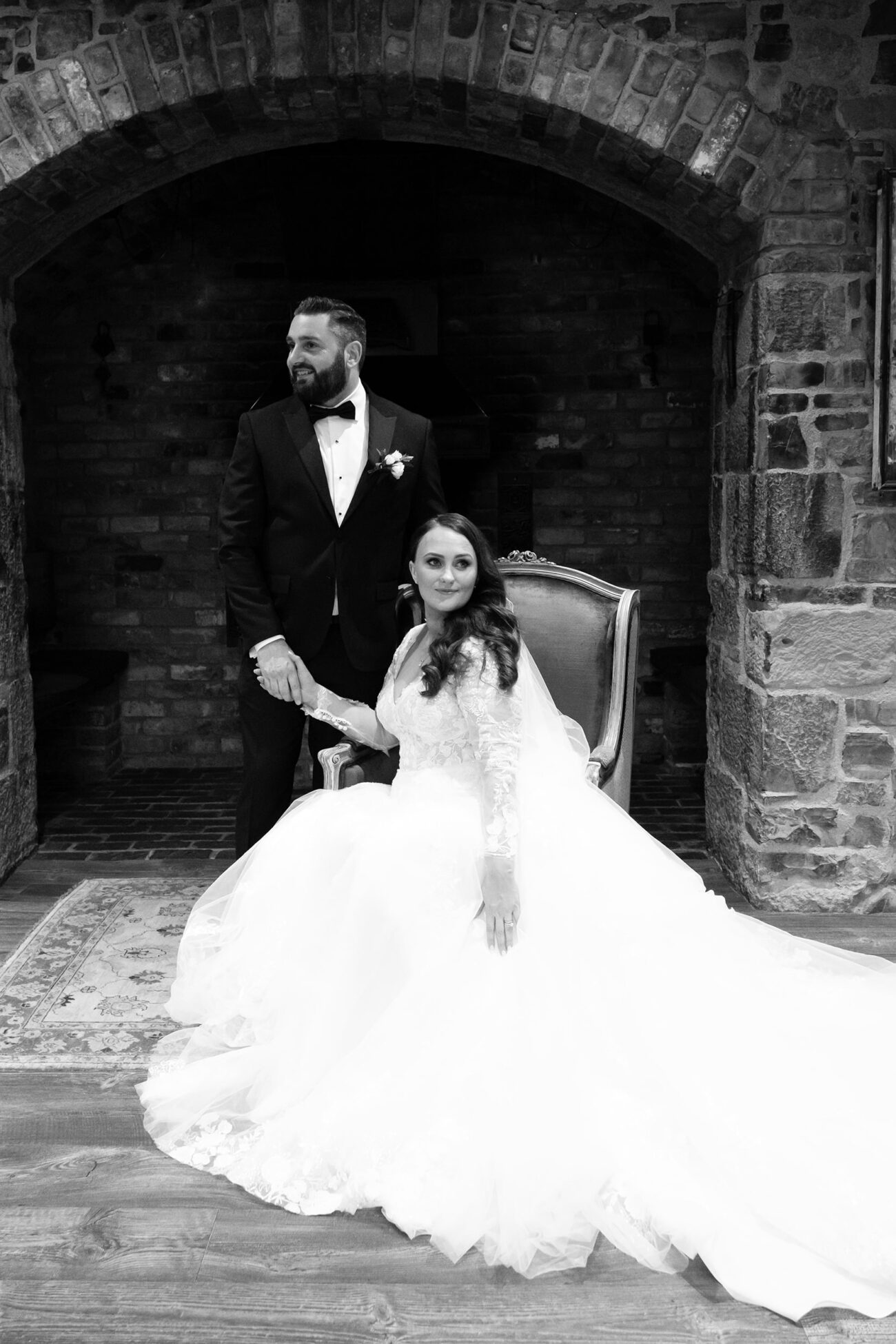 brdie seated and groom standing in the Mill House of Ballmagarvey Village